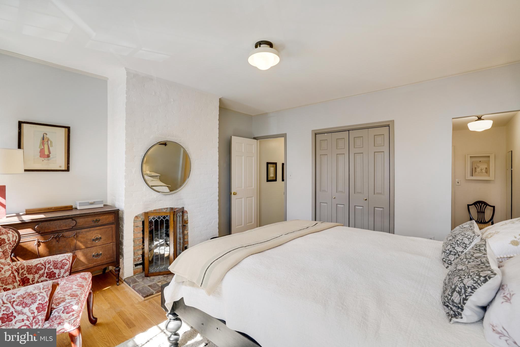 817 Duke Street Alexandria, VA 22314 - Photo 26 of 39 a bedroom with a bed and wooden closet