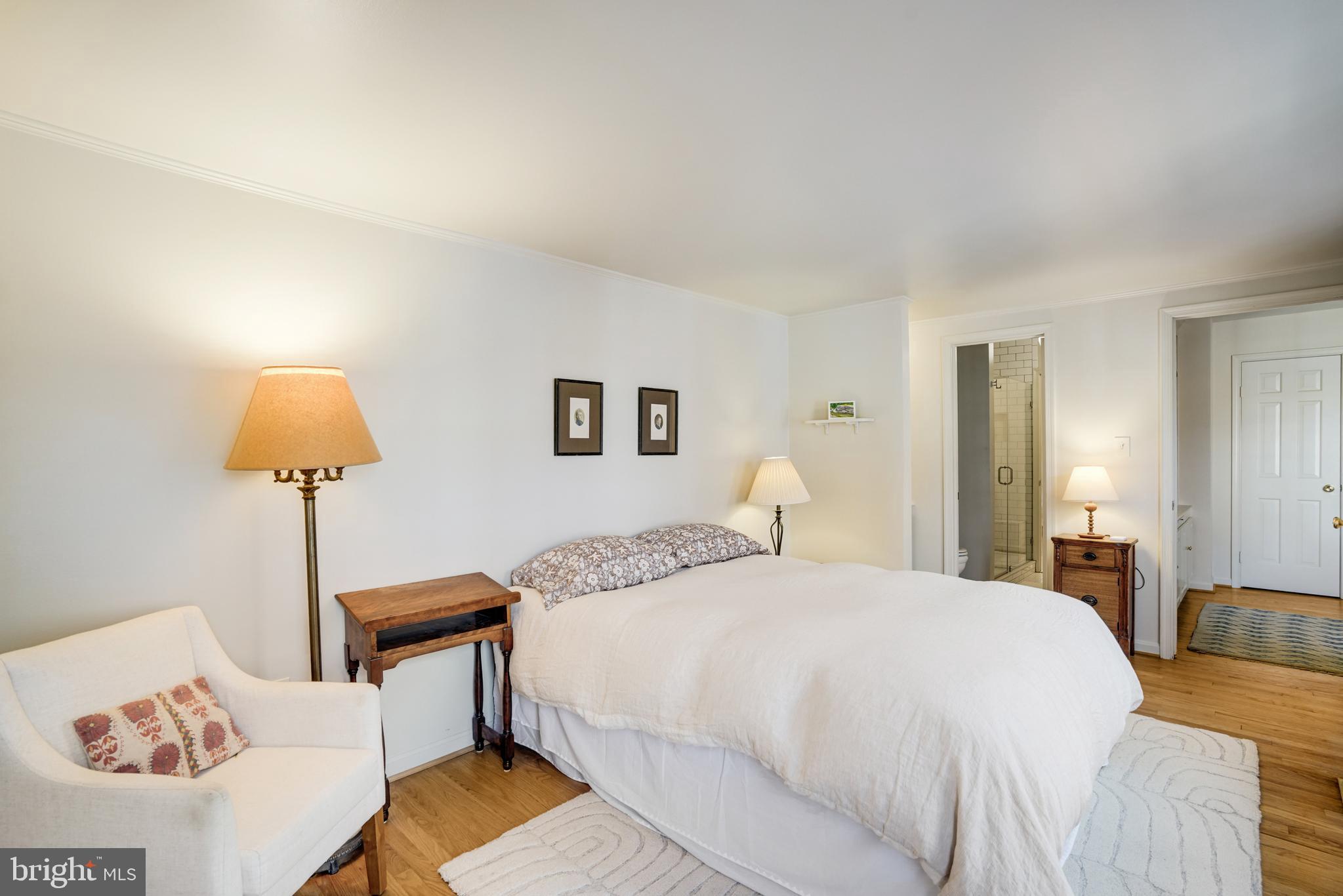 817 Duke Street Alexandria, VA 22314 - Photo 30 of 39 a bedroom with a bed and a lamp