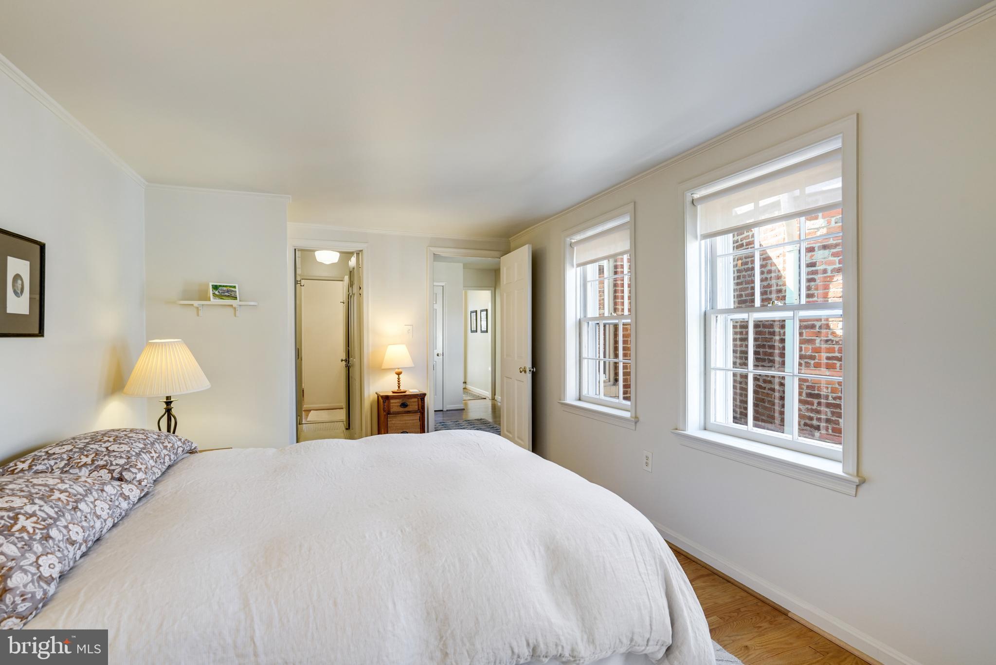 817 Duke Street Alexandria, VA 22314 - Photo 31 of 39 a bedroom with a bed and a window