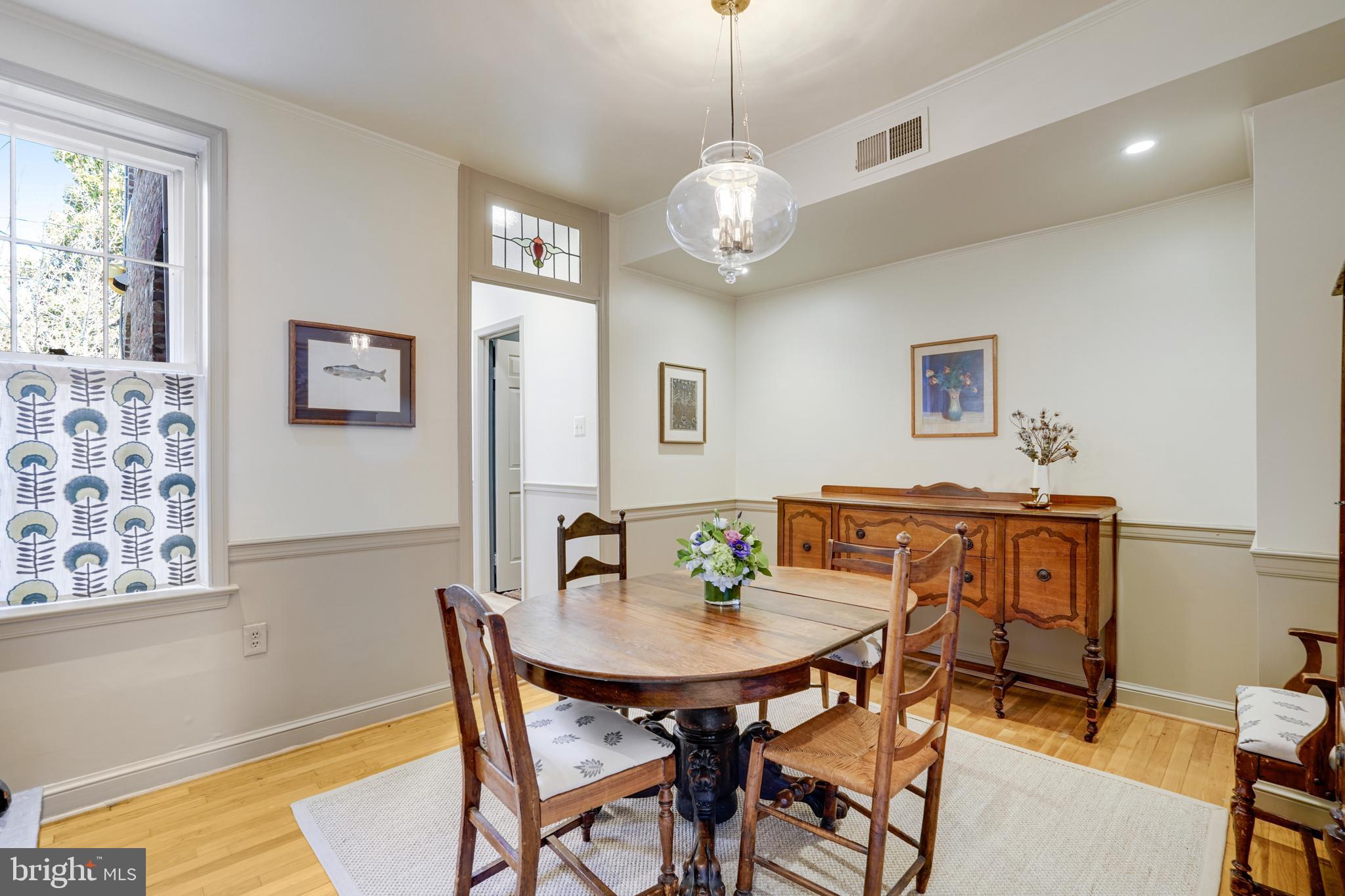 817 Duke Street Alexandria, VA 22314 - Photo 8 of 39 a view of a dining room with furniture and chandelier