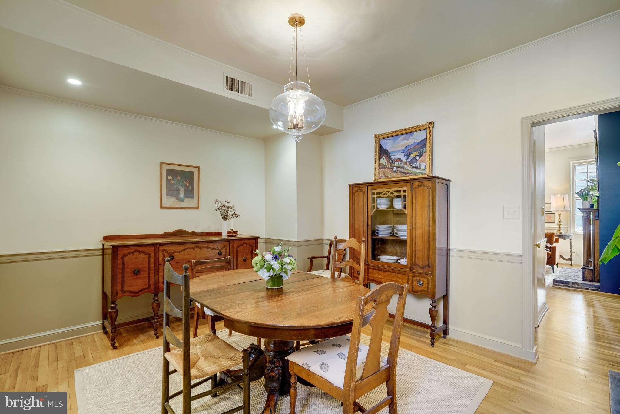 817 Duke Street Alexandria, VA 22314 - Photo 9 of 39 a view of a dining room with furniture and wooden floor