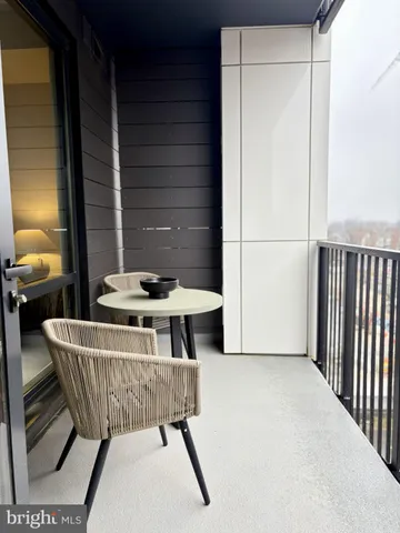 a view of a room that has a table and a chair