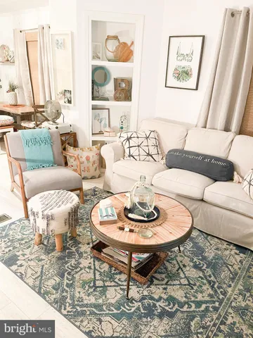 a living room with furniture and a table