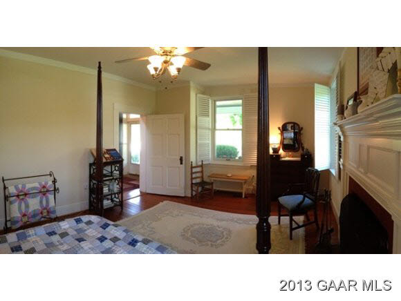 1766 Moffett Branch Road Churchville, VA 24421 - Photo 14 of 32 a living room with furniture a dining table and a fireplace