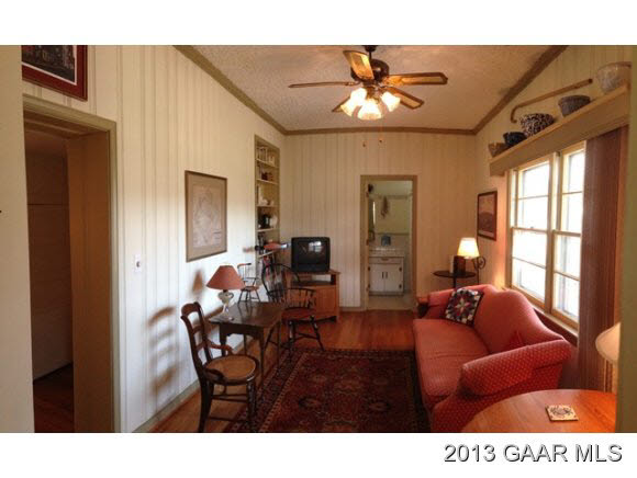 1766 Moffett Branch Road Churchville, VA 24421 - Photo 21 of 32 a living room with furniture a chandelier and a dining table