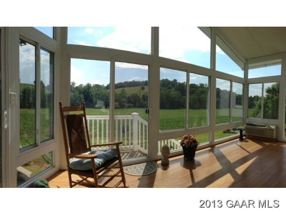 1766 Moffett Branch Road Churchville, VA 24421 - Photo 24 of 32 a living room filled with furniture and a floor to ceiling window