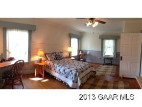 1766 Moffett Branch Road Churchville, VA 24421 - Photo 26 of 32 a spacious bedroom with a bed window and dresser