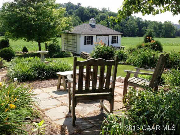 1766 Moffett Branch Road Churchville, VA 24421 - Photo 9 of 32 a view of a wooden bench and chair in the garden