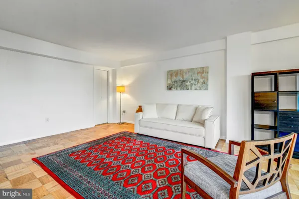 a living room with a bed and a couch