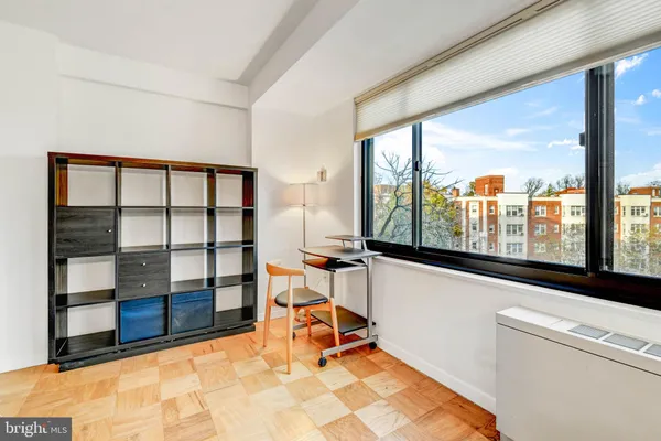 a room with furniture and a window