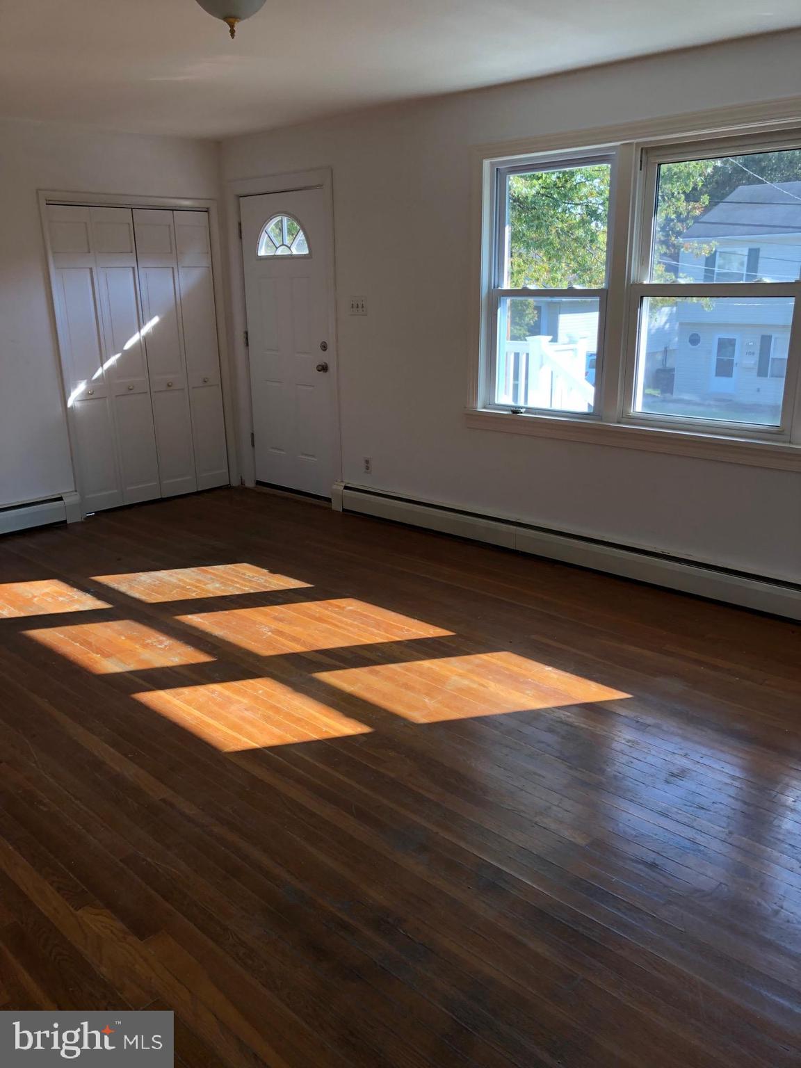 107 Cedar Road Wallingford, PA 19086 - Photo 20 of 30 Living Room. Guest closet and front door.