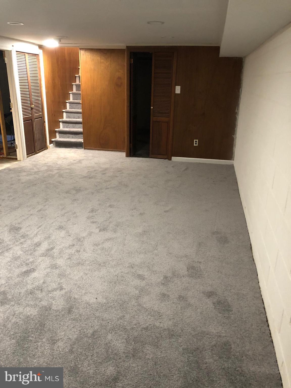 107 Cedar Road Wallingford, PA 19086 - Photo 21 of 30 Lower level rec room, laundry and storage space.