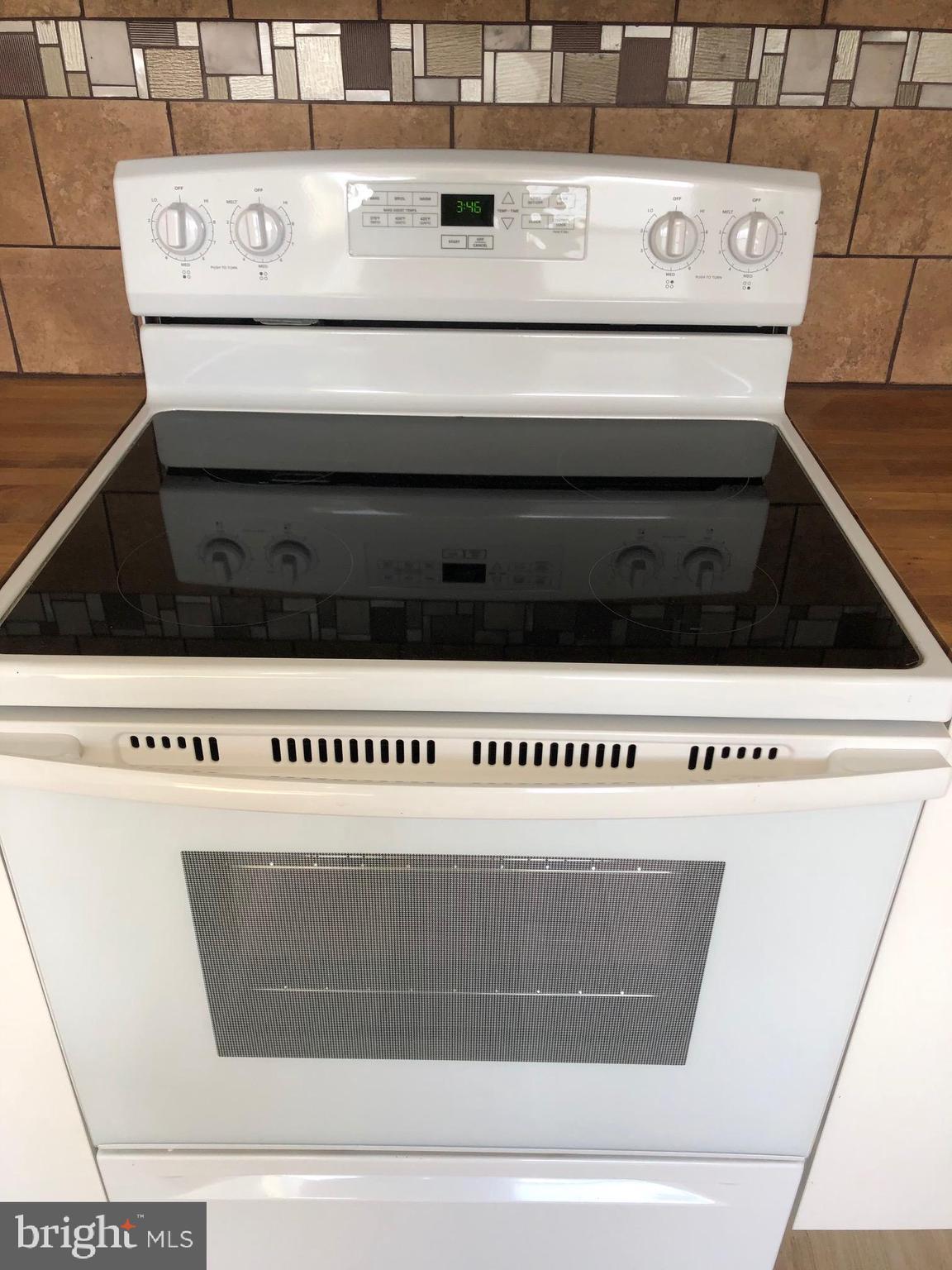 107 Cedar Road Wallingford, PA 19086 - Photo 8 of 30 New S/C electric range/oven, space saver Microwave