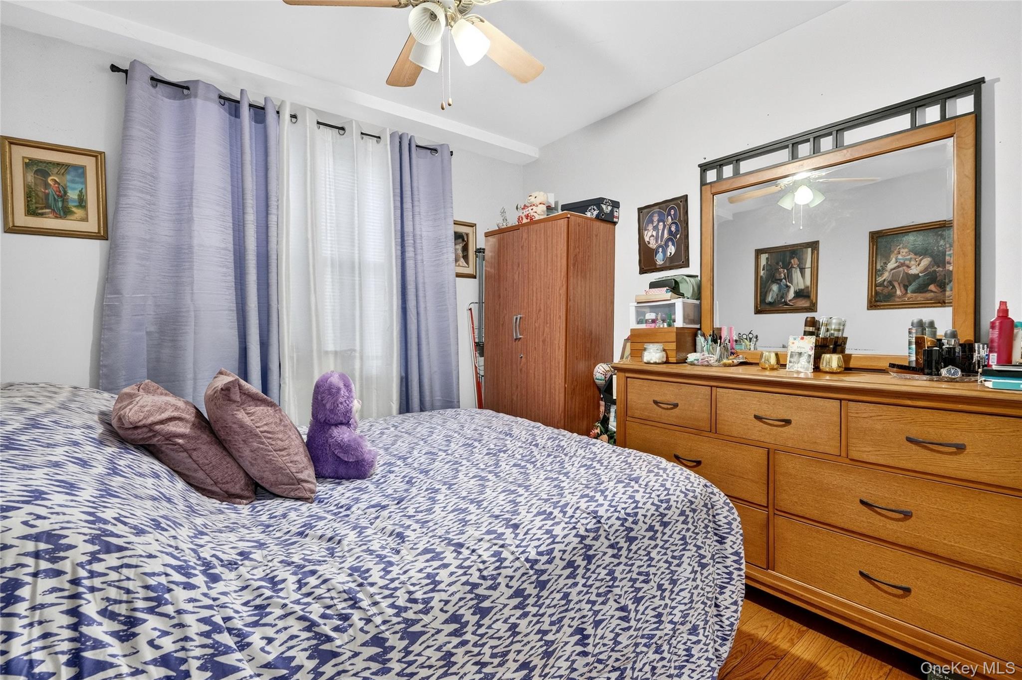 1459 Rosedale Avenue Bronx, NY 10460 - Photo 10 of 37 Bedroom featuring a ceiling fan and wood finished floors