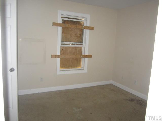 1122 Summerkings Court Raleigh, NC 27610 - Photo 11 of 11 an empty room with a window