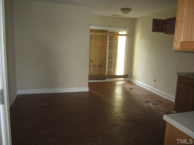 1122 Summerkings Court Raleigh, NC 27610 - Photo 8 of 11 a view of room with window and wooden floor