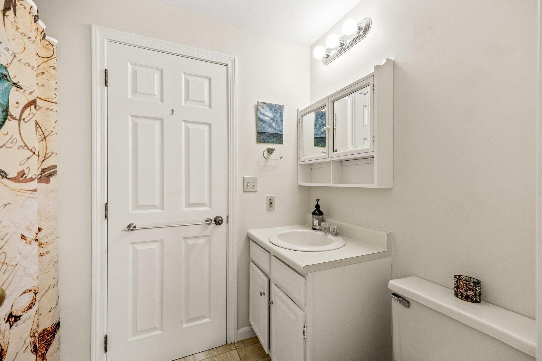 85 Eben Smith Road Centerville, MA 02632 - Photo 24 of 28 a bathroom with a sink and a mirror