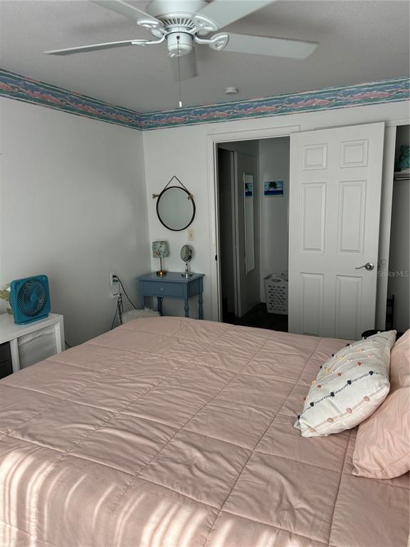 1524 Pleasant Road, Unit G24 Bradenton, FL 34207 - Photo 11 of 18 a bedroom with a bed and wooden floor