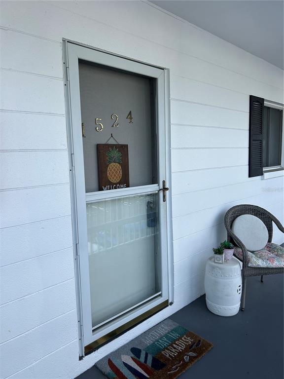 1524 Pleasant Road, Unit G24 Bradenton, FL 34207 - Photo 3 of 18 a room with a wooden floor and a sink