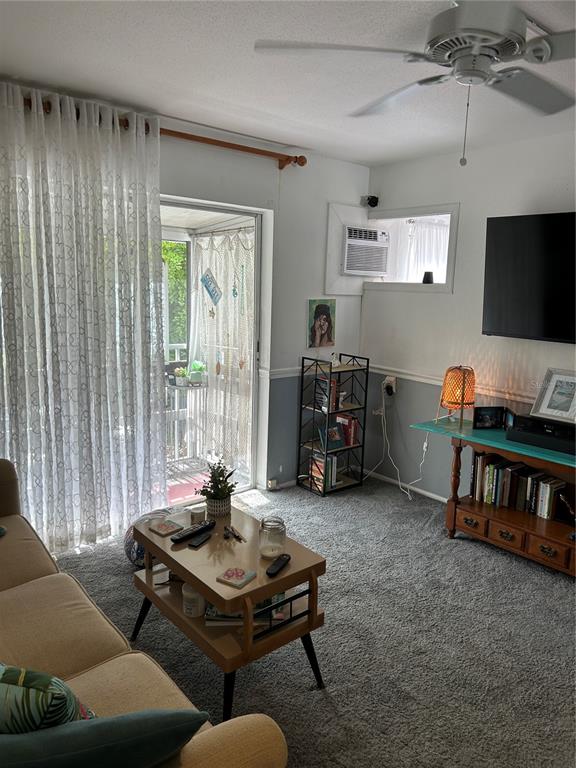 1524 Pleasant Road, Unit G24 Bradenton, FL 34207 - Photo 5 of 18 a living room with furniture and a flat screen tv