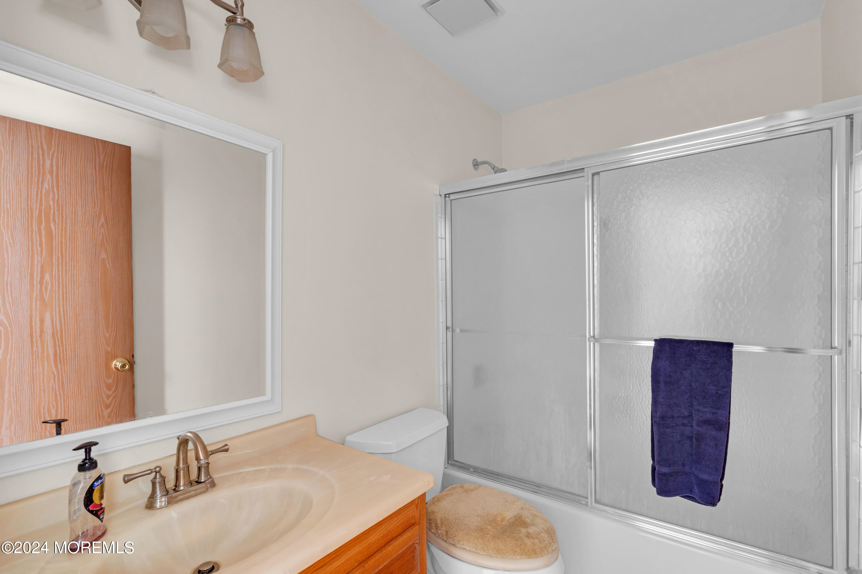 3 Stonybrook Road, Unit 60 Whiting, NJ 08759 - Photo 30 of 33 a bathroom with a sink and a mirror