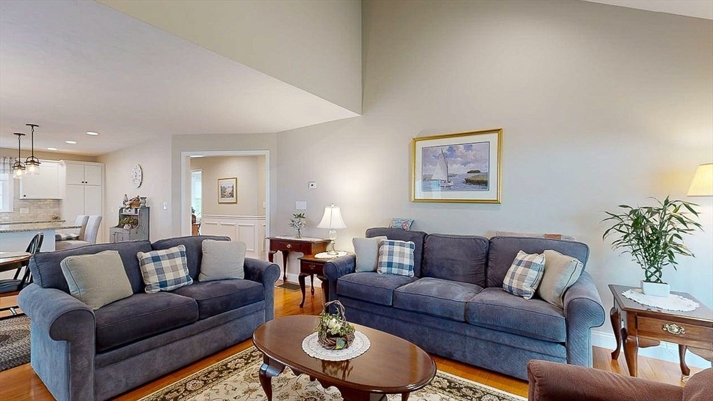 67 Cobblestone Lane, Unit 63 Worcester, MA 01606 - Photo 14 of 38 a living room with furniture and a wooden floor
