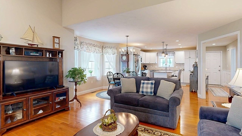 67 Cobblestone Lane, Unit 63 Worcester, MA 01606 - Photo 16 of 38 a living room with furniture and a flat screen tv