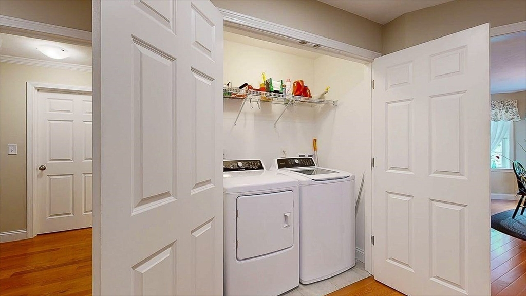67 Cobblestone Lane, Unit 63 Worcester, MA 01606 - Photo 19 of 38 a view of storage and utility room with washer and dryer