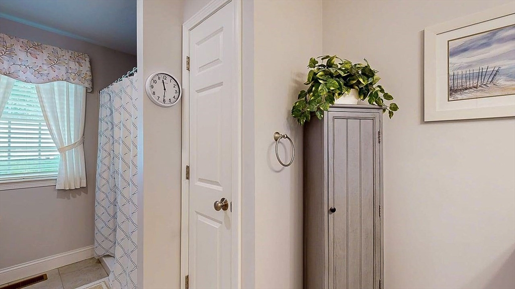 67 Cobblestone Lane, Unit 63 Worcester, MA 01606 - Photo 21 of 38 a vase with flowers on it with window