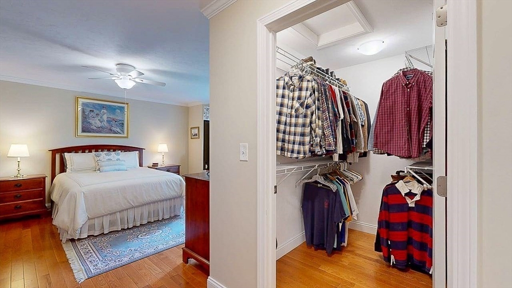 67 Cobblestone Lane, Unit 63 Worcester, MA 01606 - Photo 28 of 38 a bedroom with a bed and a mirror