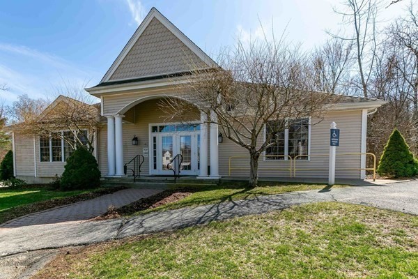 67 Cobblestone Lane, Unit 63 Worcester, MA 01606 - Photo 36 of 38 a front view of a house with a yard