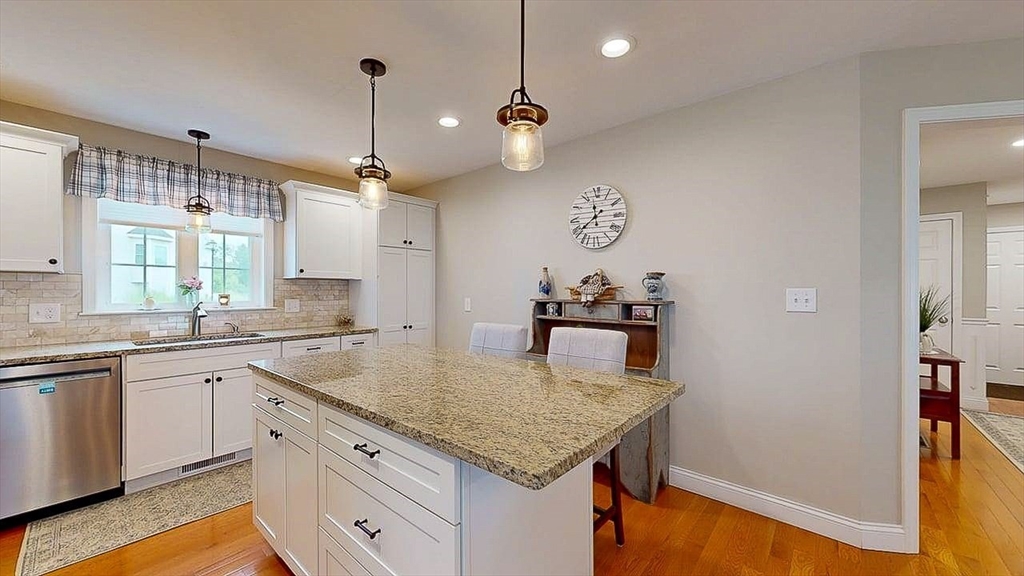 67 Cobblestone Lane, Unit 63 Worcester, MA 01606 - Photo 6 of 38 a kitchen with a stove a sink and a refrigerator