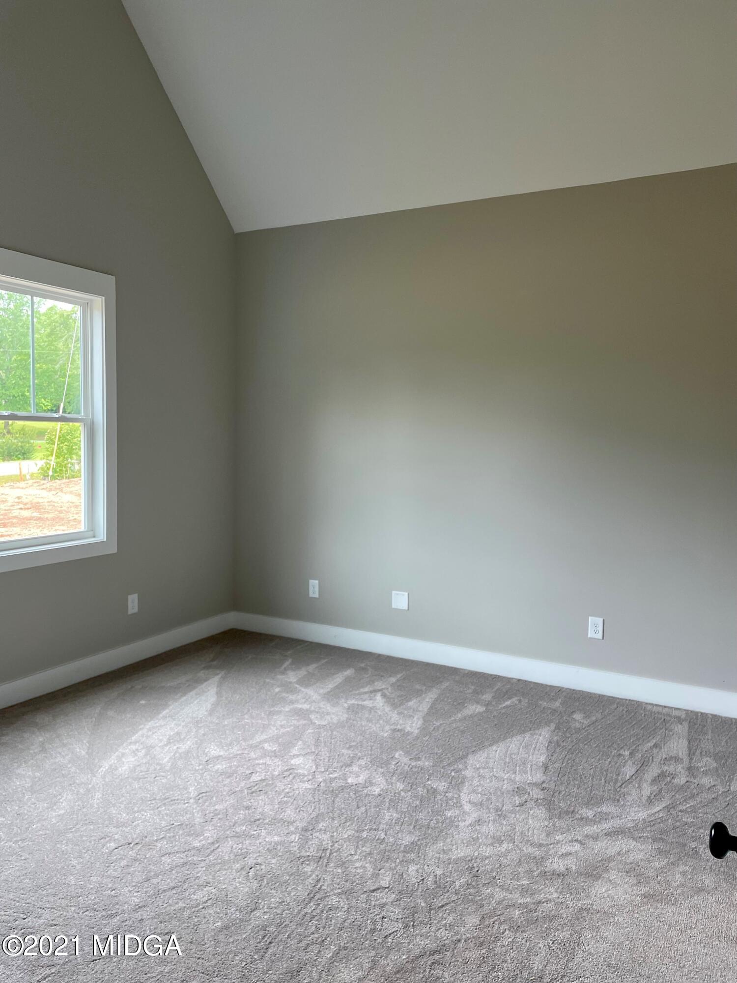 1194 Josey Road Forsyth, GA 31029 - Photo 5 of 9 an empty room with a window