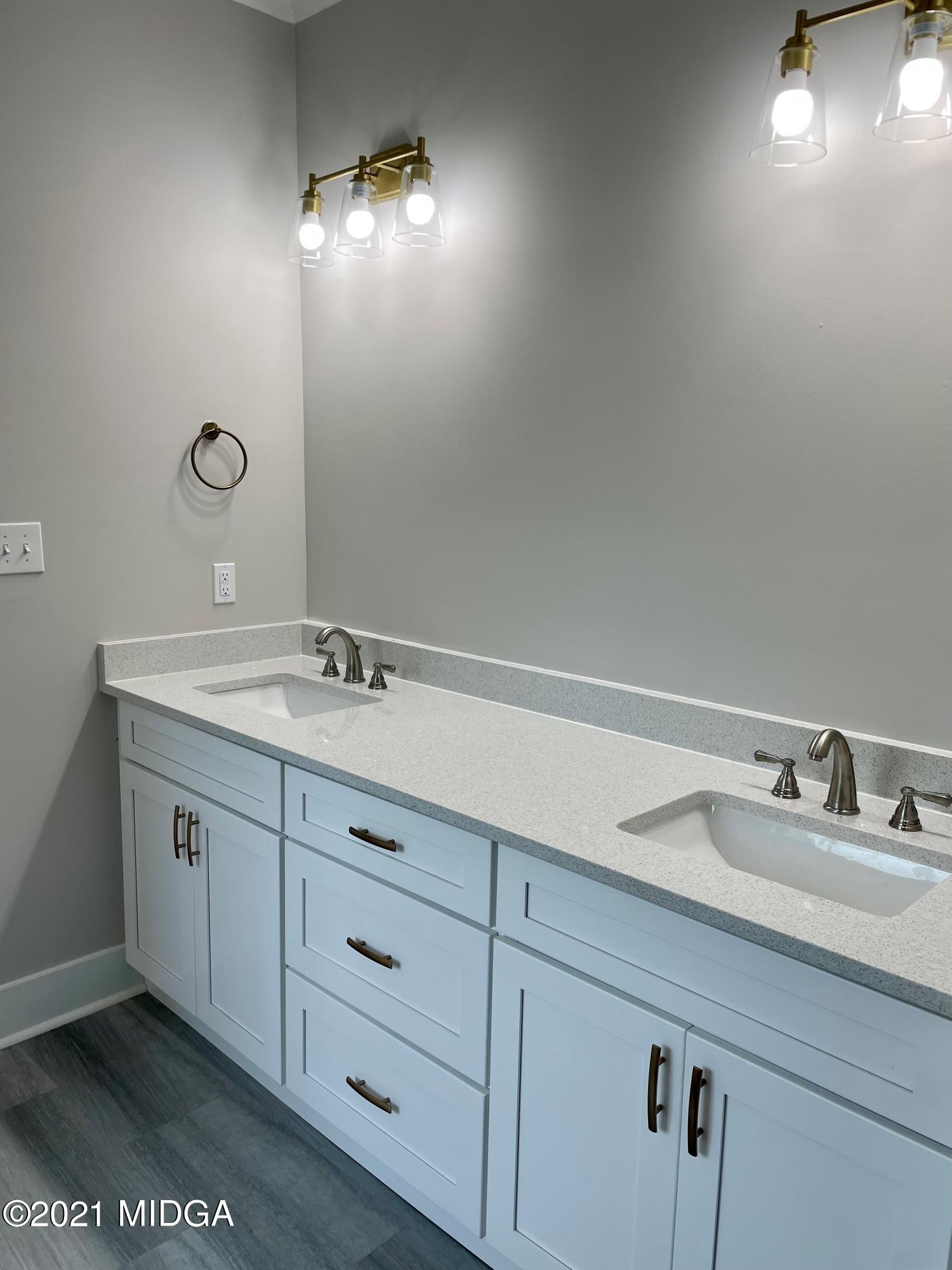 1194 Josey Road Forsyth, GA 31029 - Photo 8 of 9 a bathroom with a sink and a mirror