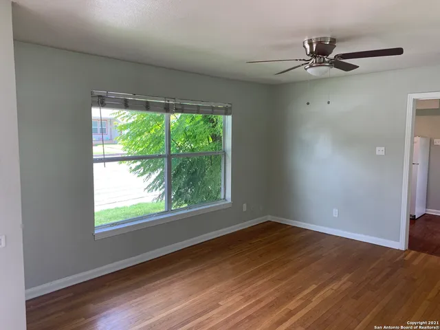 a view of a room with a large window