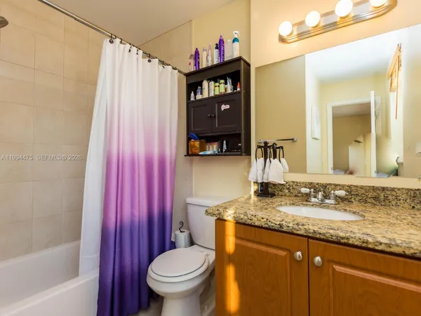a bathroom with a shower and a shower curtain