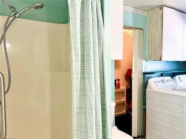 a bathroom with a sink and a shower curtain