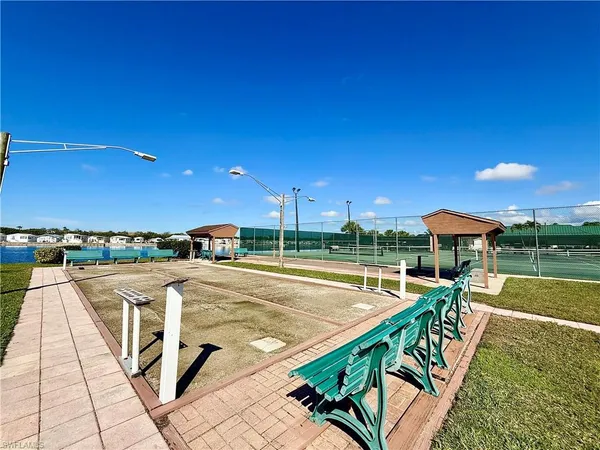 a park with a bench and trees