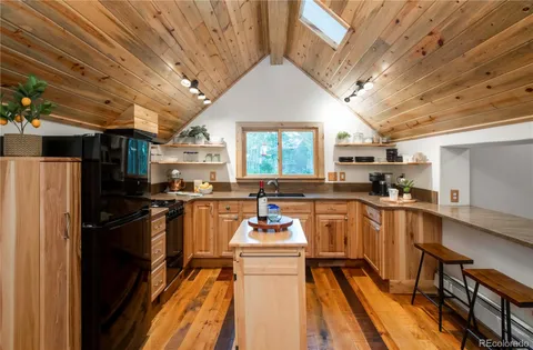 a kitchen with table and chairs