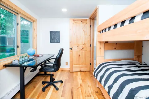 a bedroom with a bed and a table