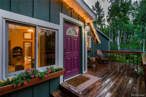 a view of a two chairs in the balcony