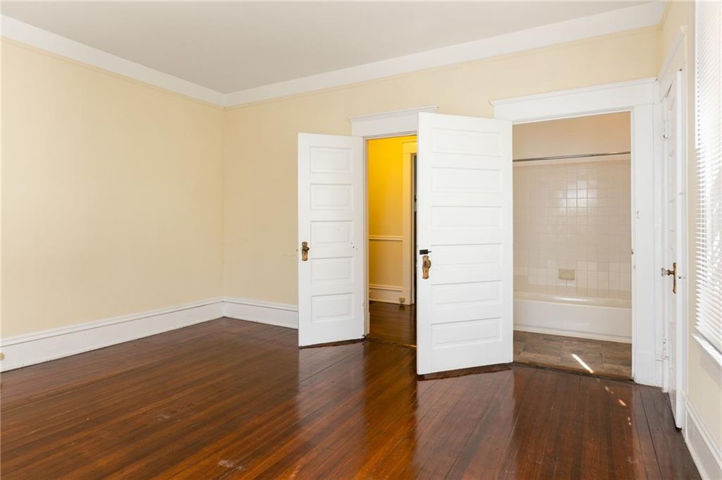 120 South Candler Street Decatur, GA 30030 - Photo 19 of 40 an empty room with wooden floor and entrance