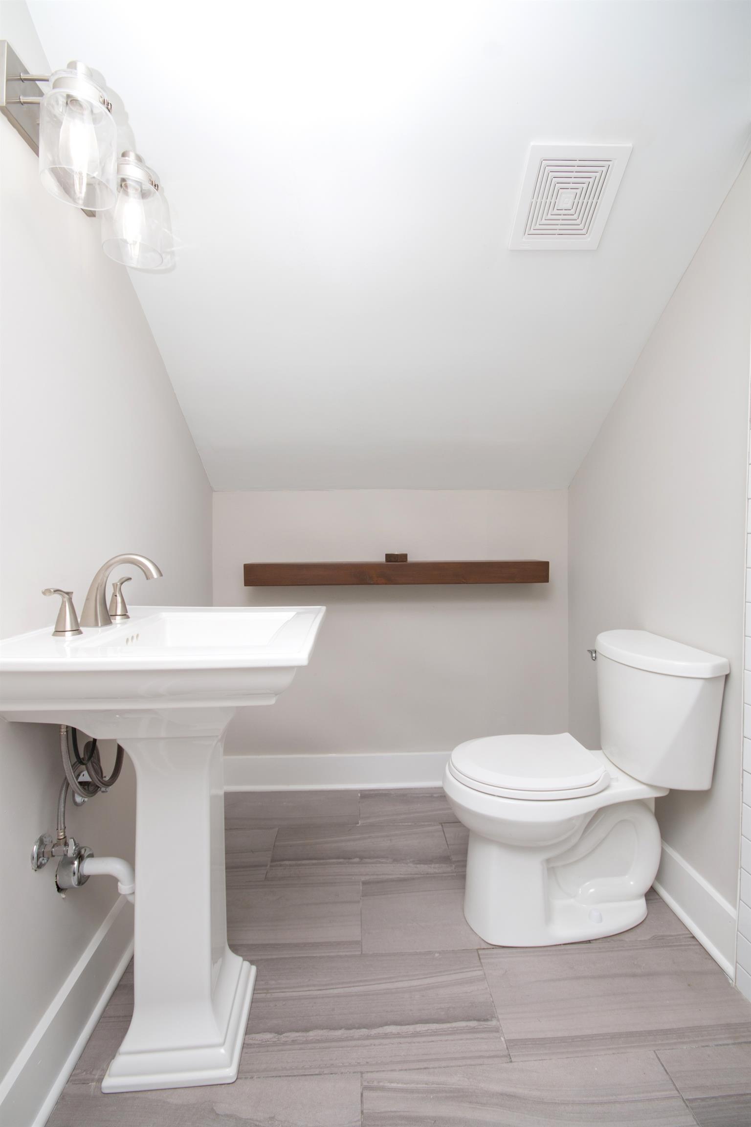 1003 Neelys Bend Road Madison, TN 37115 - Photo 18 of 30 a bathroom with a sink and a toilet