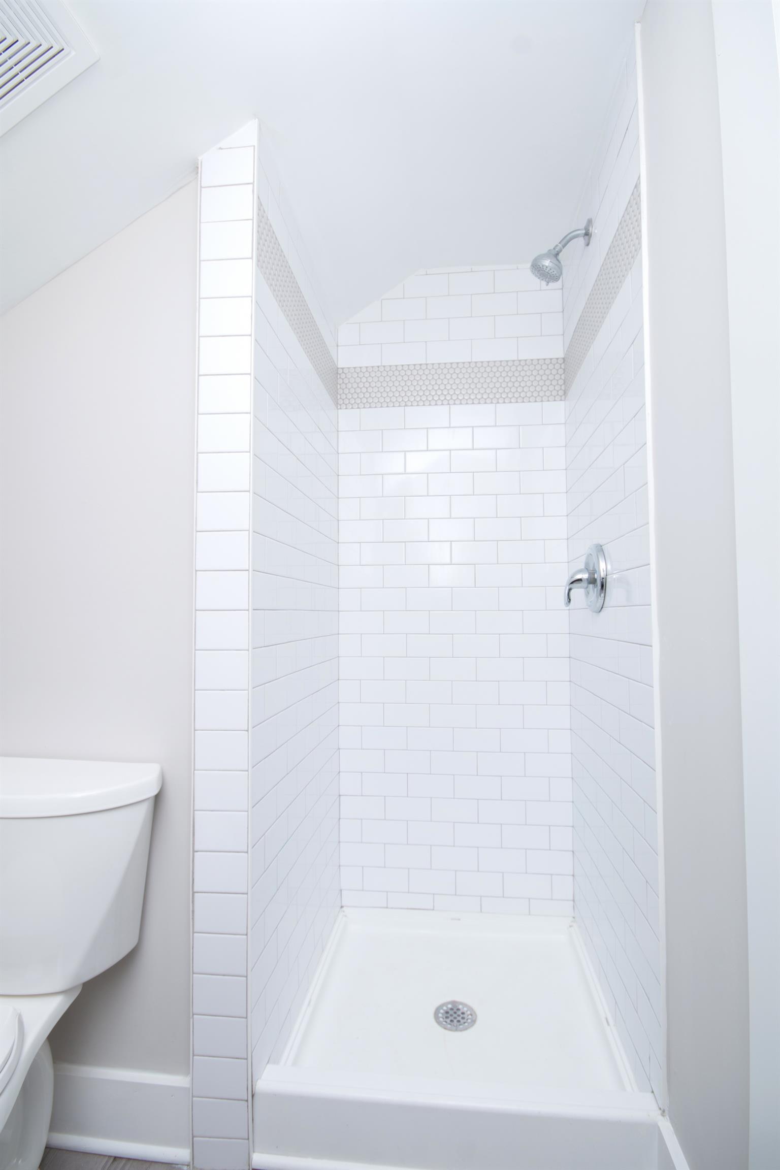 1003 Neelys Bend Road Madison, TN 37115 - Photo 19 of 30 a bathroom with a shower and a toilet