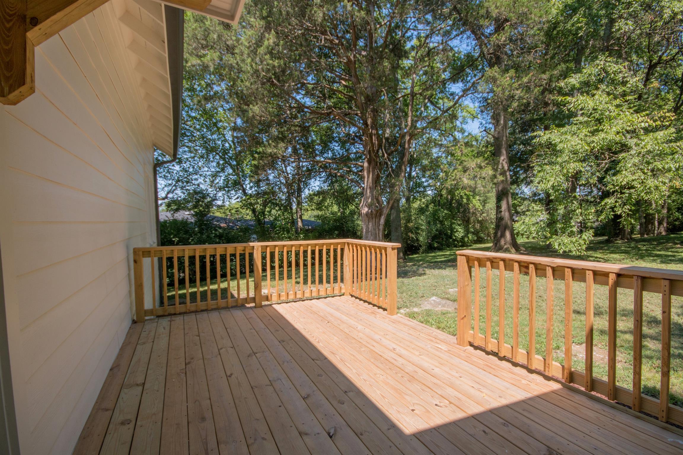 1003 Neelys Bend Road Madison, TN 37115 - Photo 21 of 30 a balcony with wooden floor and outdoor space