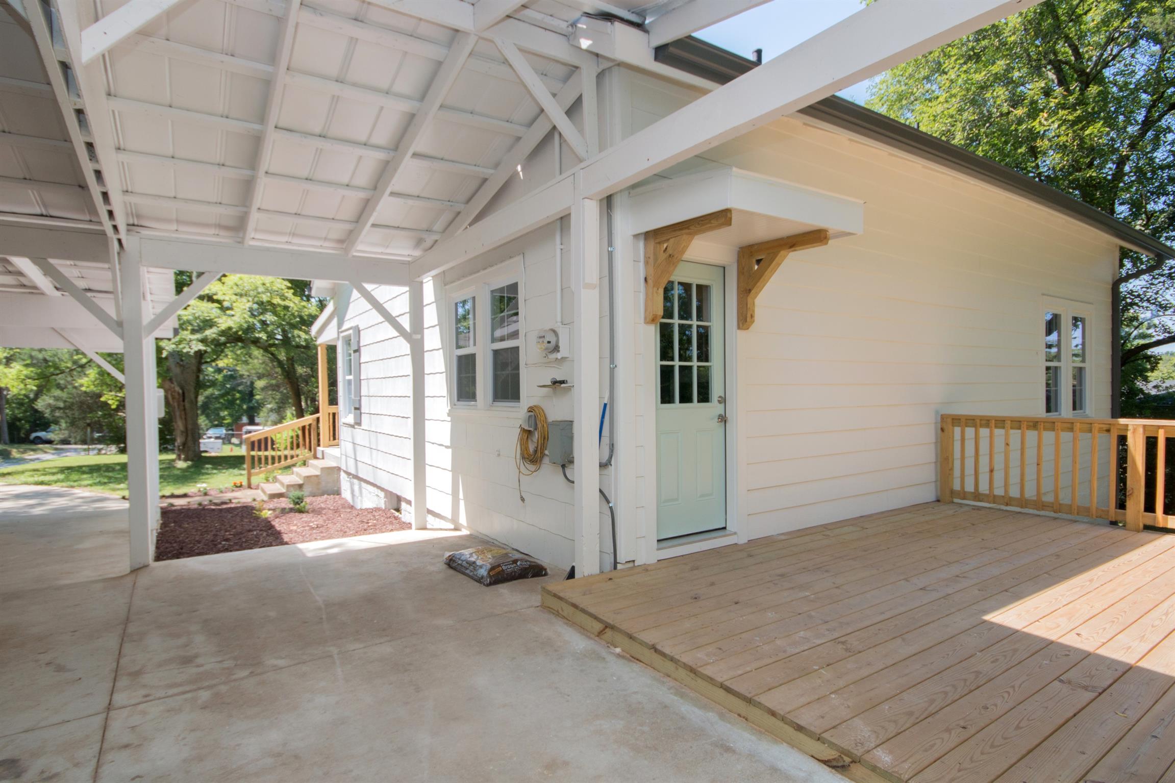 1003 Neelys Bend Road Madison, TN 37115 - Photo 23 of 30 a view of a porch with furniture and floor to ceiling window
