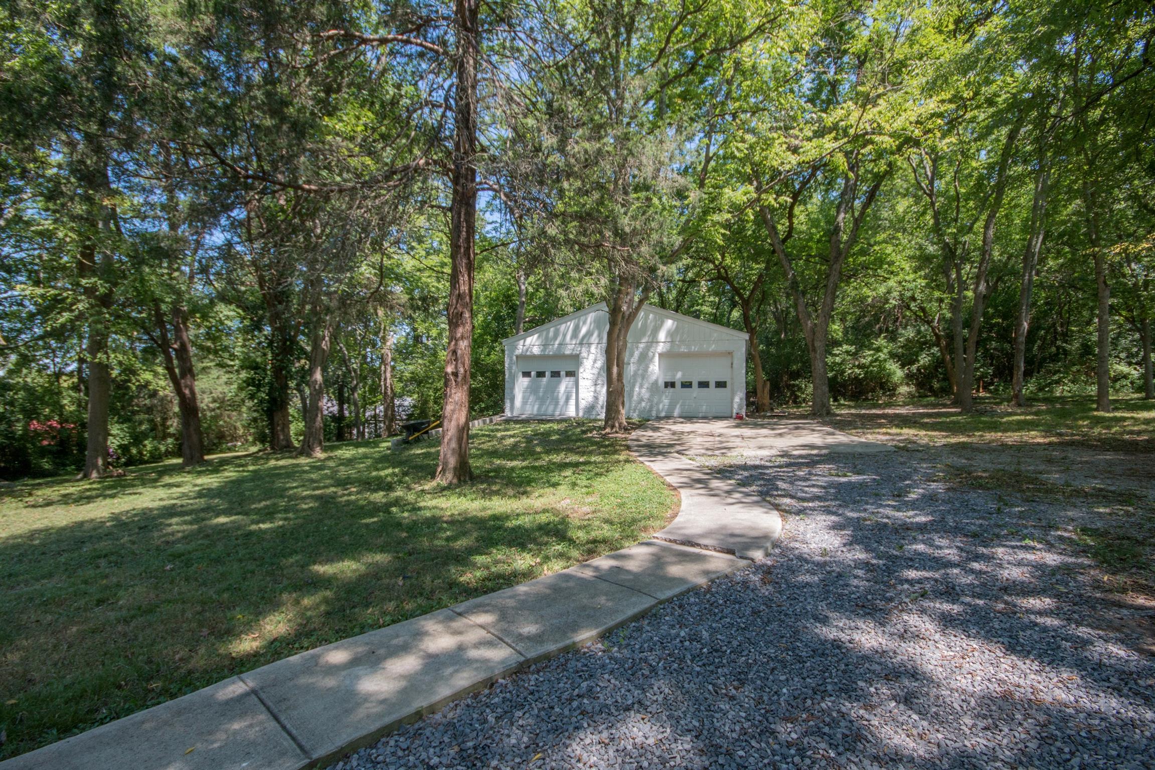 1003 Neelys Bend Road Madison, TN 37115 - Photo 26 of 30 a front view of a house with a yard