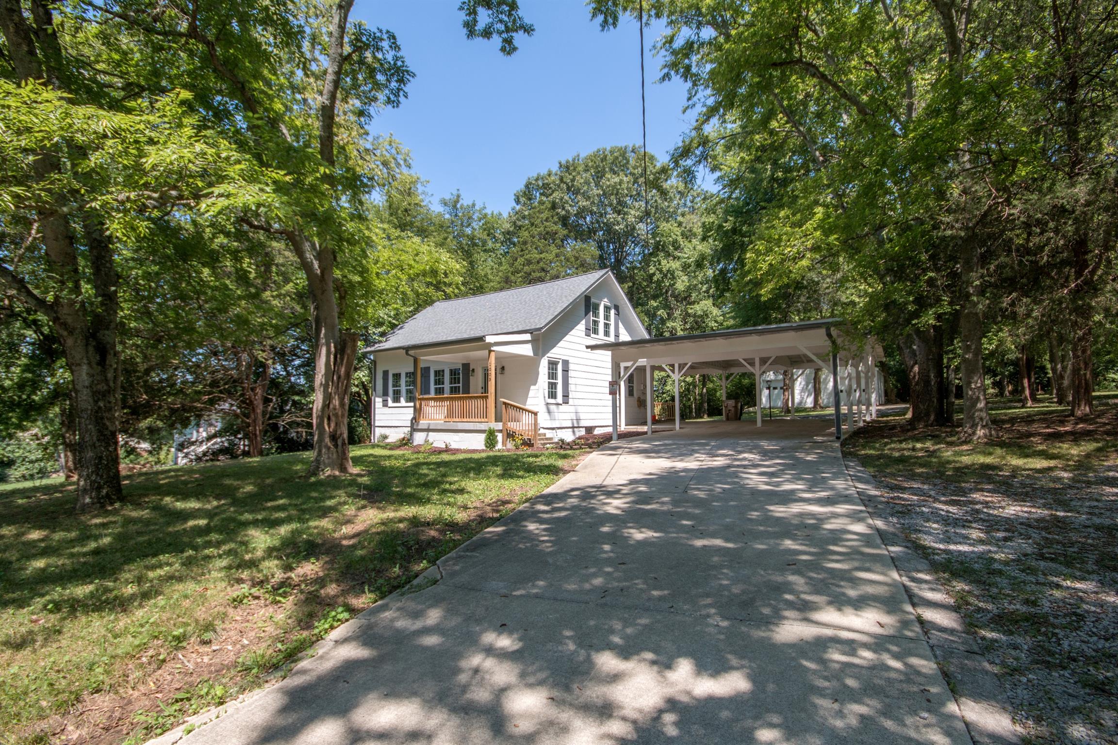 1003 Neelys Bend Road Madison, TN 37115 - Photo 28 of 30 a front view of a house with a garden