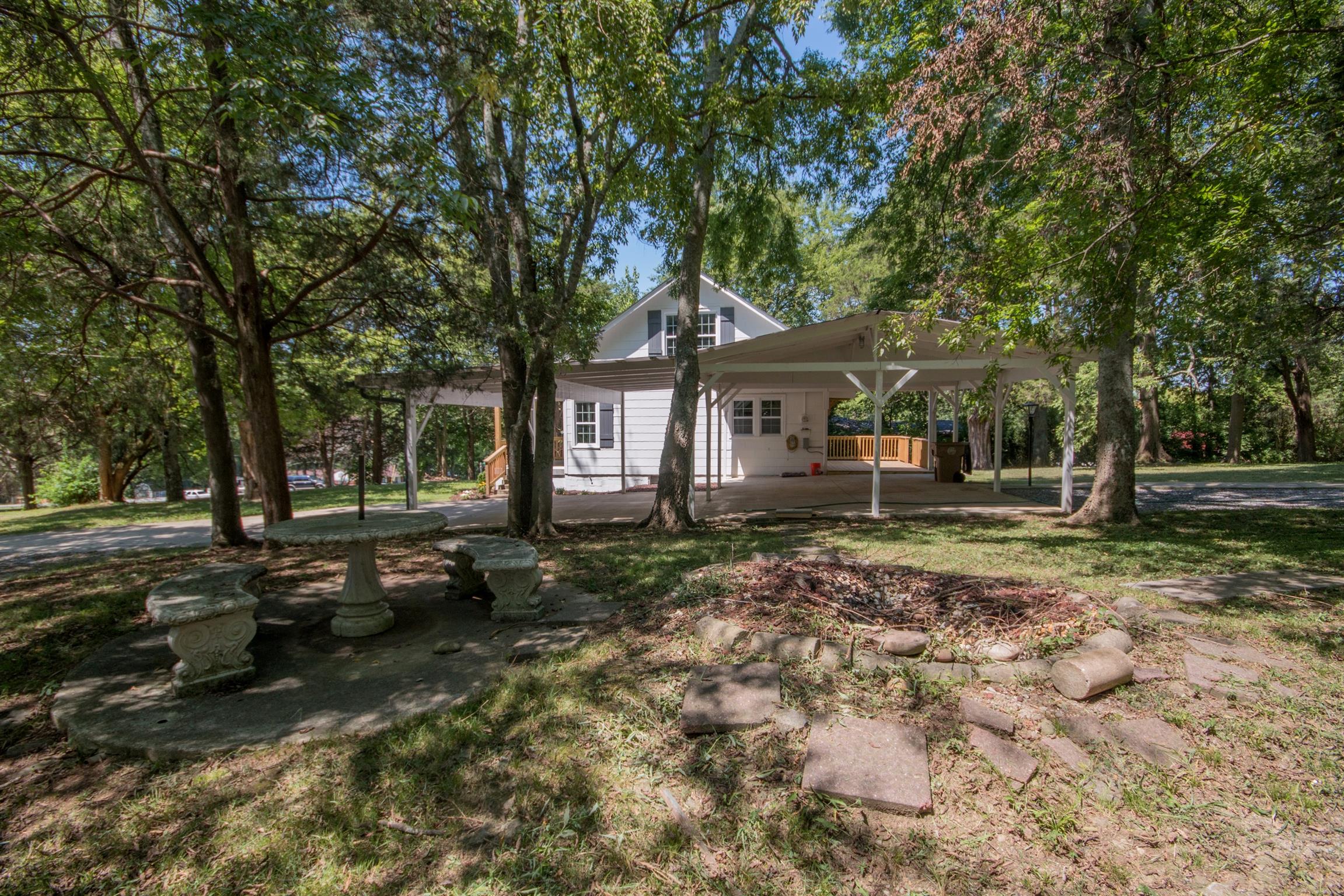 1003 Neelys Bend Road Madison, TN 37115 - Photo 29 of 30 a front view of a house with a yard