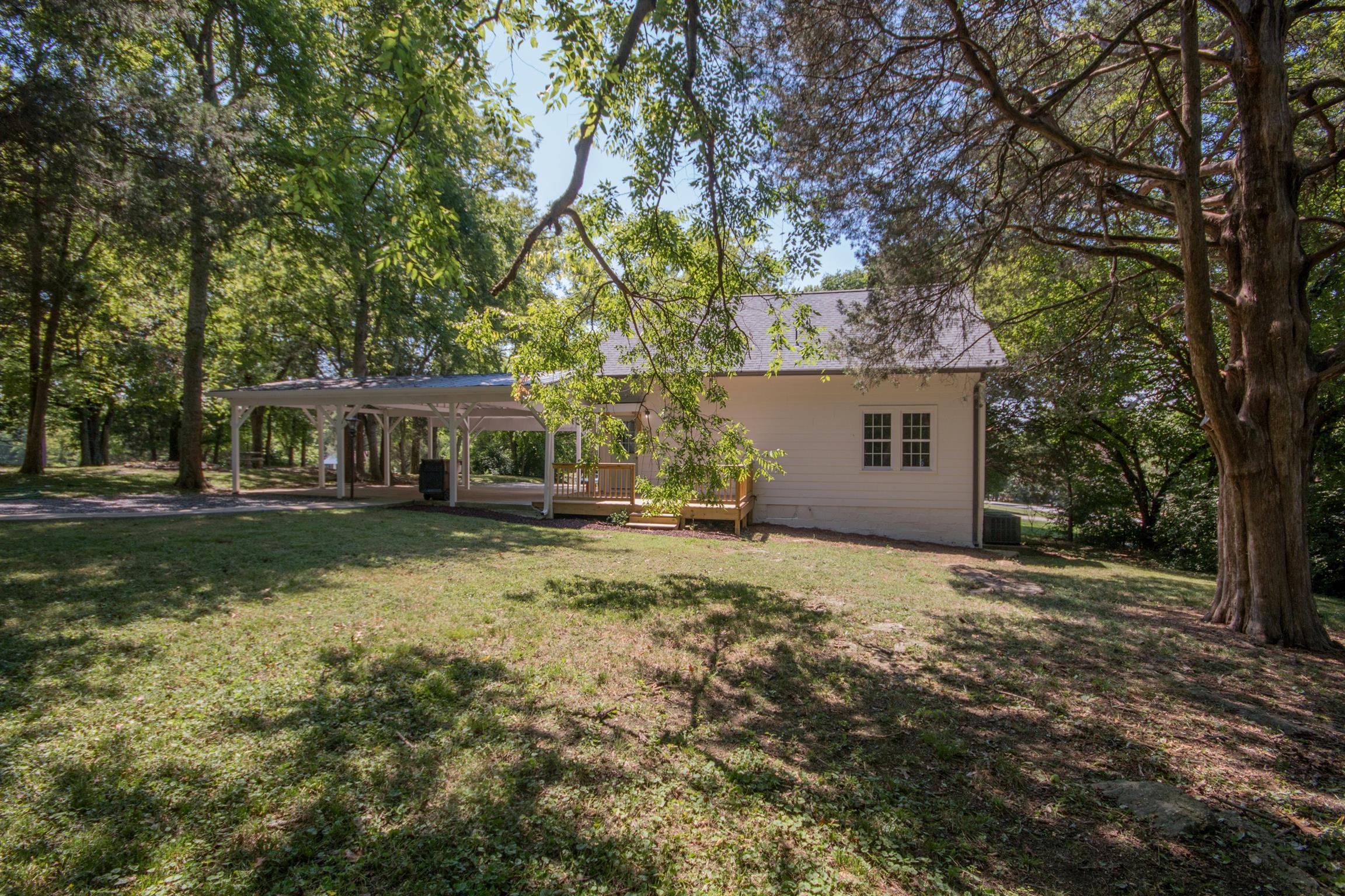 1003 Neelys Bend Road Madison, TN 37115 - Photo 30 of 30 a front view of a house with a garden